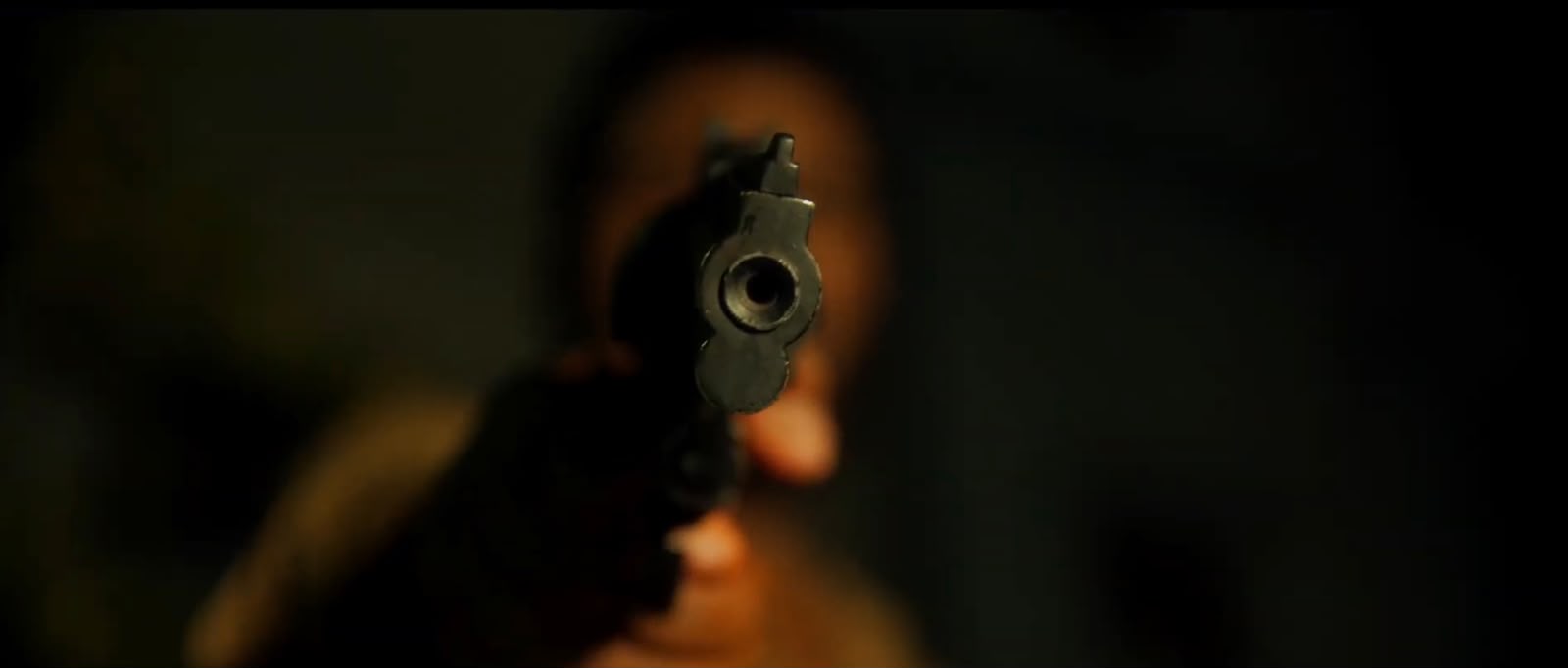 Gun aimed toward camera